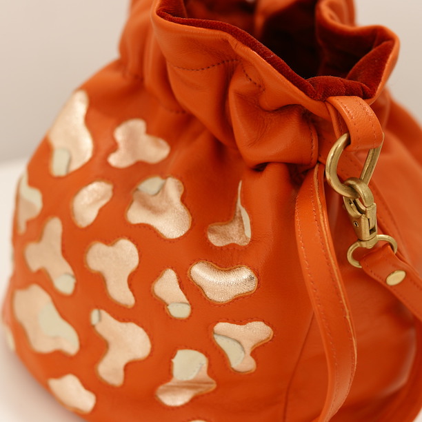 Libertas leather bags in tangerine by Amma Gyan at Amanartis