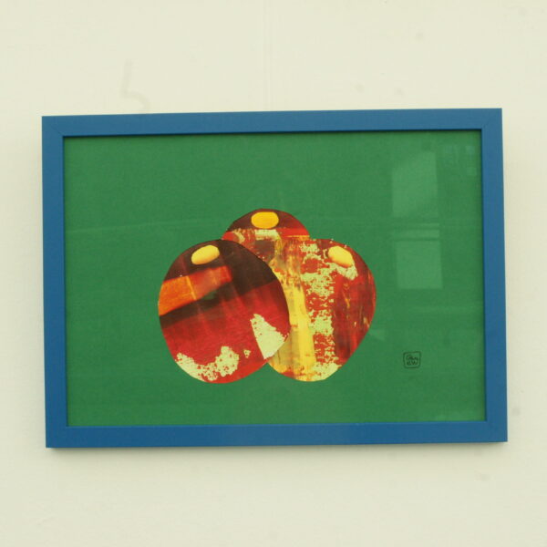 Cacti by Glenda Wood inspired by the Jardin Majorelle Marrakesh Morroco. Acrylic painted cacti cut out in red and yellow on solid green background with a blue frame