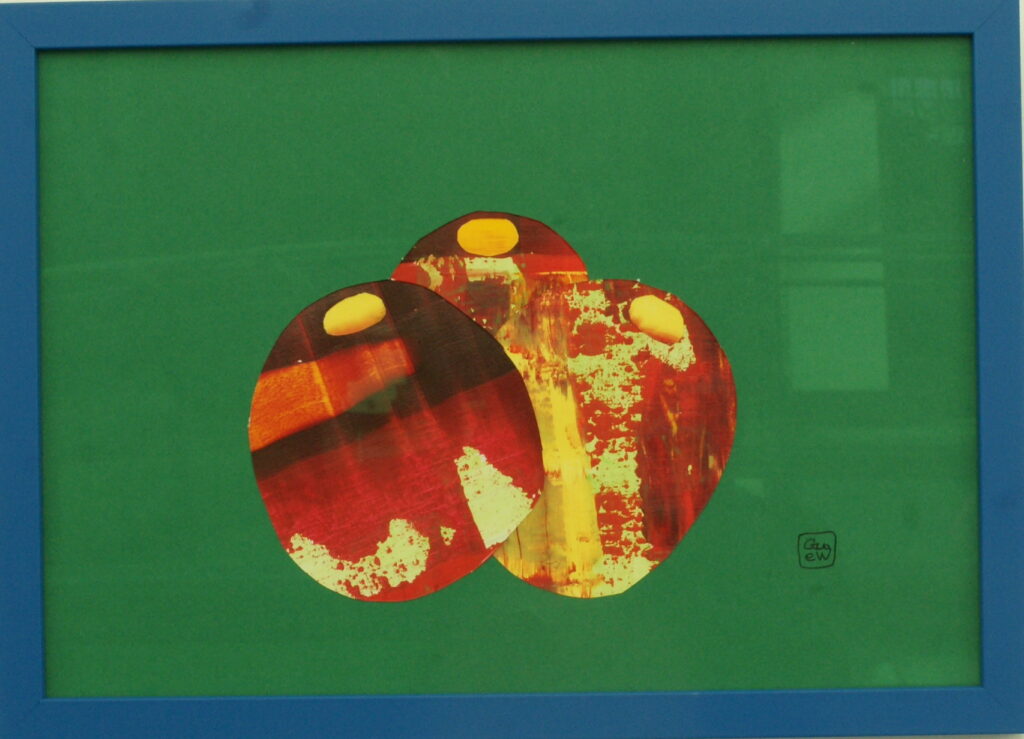 Jardin Cut Out by Glenda Wood at Amanartis Gallery and Studio Watford. Red yellow and deep red cacti on a green background framed in blue.